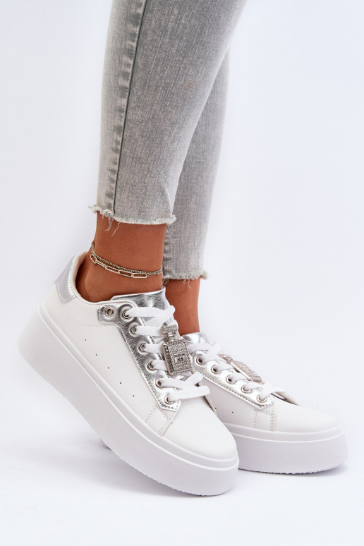 Sneakers tüüpi jalanõud   kaunistustega valget värvi Celedria